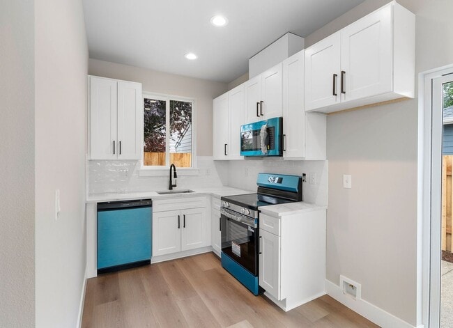 Building Photo - Brand-New Detached 2 Bedroom Home with Private Fenced Yard and Designer Finishes