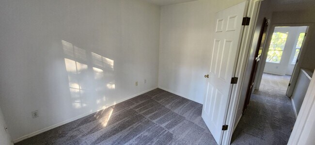 Full bedroom upstairs with mirror wardrobe closet doors - 12331 SE Whitcomb Dr.