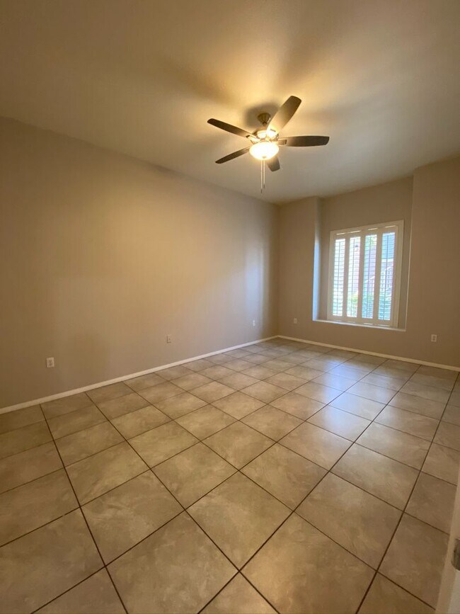 Building Photo - BEAUTIFUL CONDO IN A GATED COMMUNITY FEATURING PLANTATION SHUTTERS, TILE FLOORING AND NEW PAINT T...