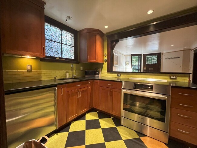 Building Photo - Charming NW Portland 1-Bedroom with Brick Accents & Modern Touches