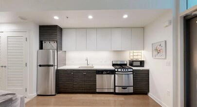 Building Photo - Corner view. Luxury. High end appliances. ...