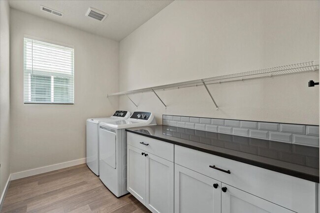 Building Photo - Brand New, Stylish 4-Bedroom Home with Vaulted Ceilings and Private Patio