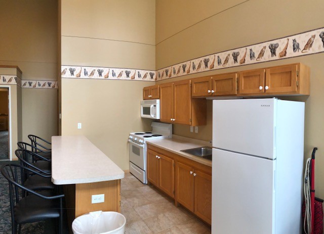 Community room includes a full kitchen. - Willow Creek Apartments