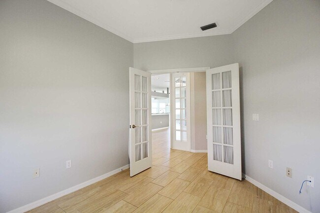 Building Photo - Annual rental: Spacious 3BR/2BA Creekwood Home with Office, Screened Lanai, EV Charger & Resort-S...