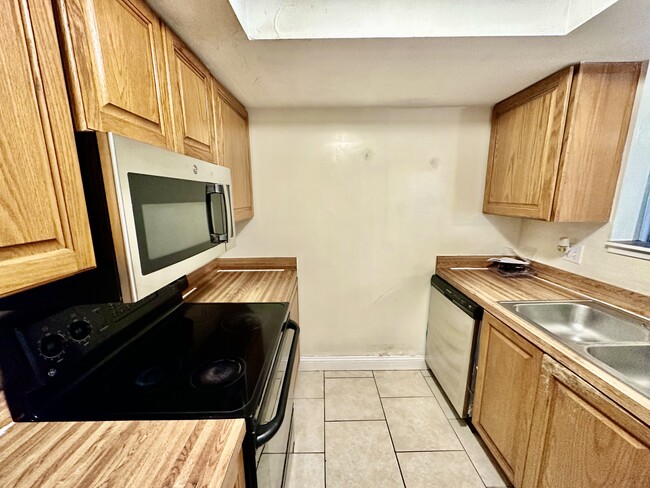 New stainless dishwasher, microwave and fridge. - 2858 Wonderwood Ln