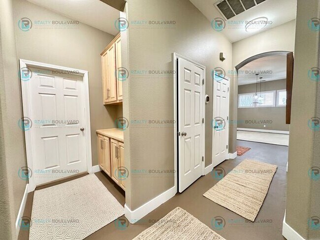 Building Photo - Open Kitchen, Expansive Living, and Covered Patio in Tranquil South Reno Near Trails, Parks & Sho...