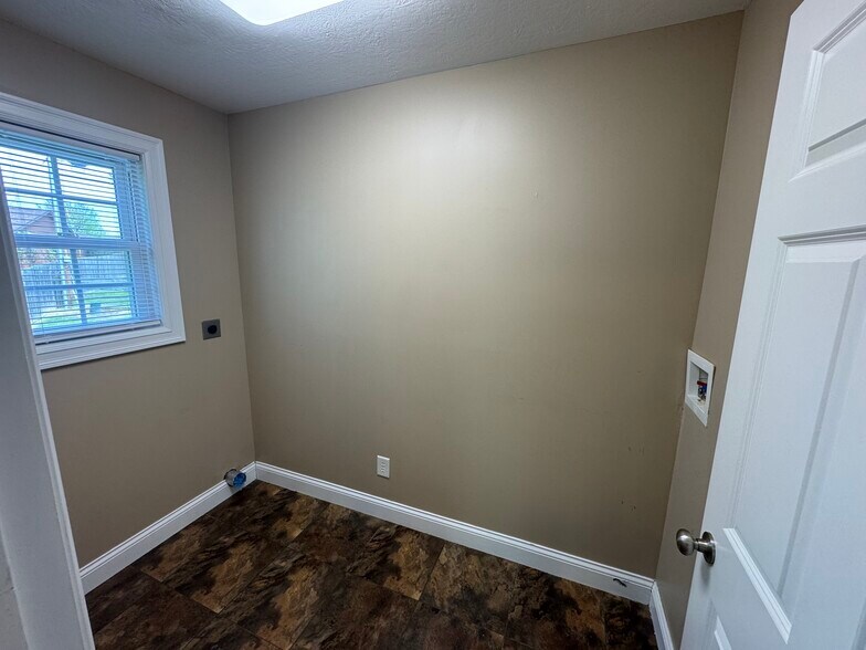 Laundry room 1st floor with hook ups only. - 1343 Easy St