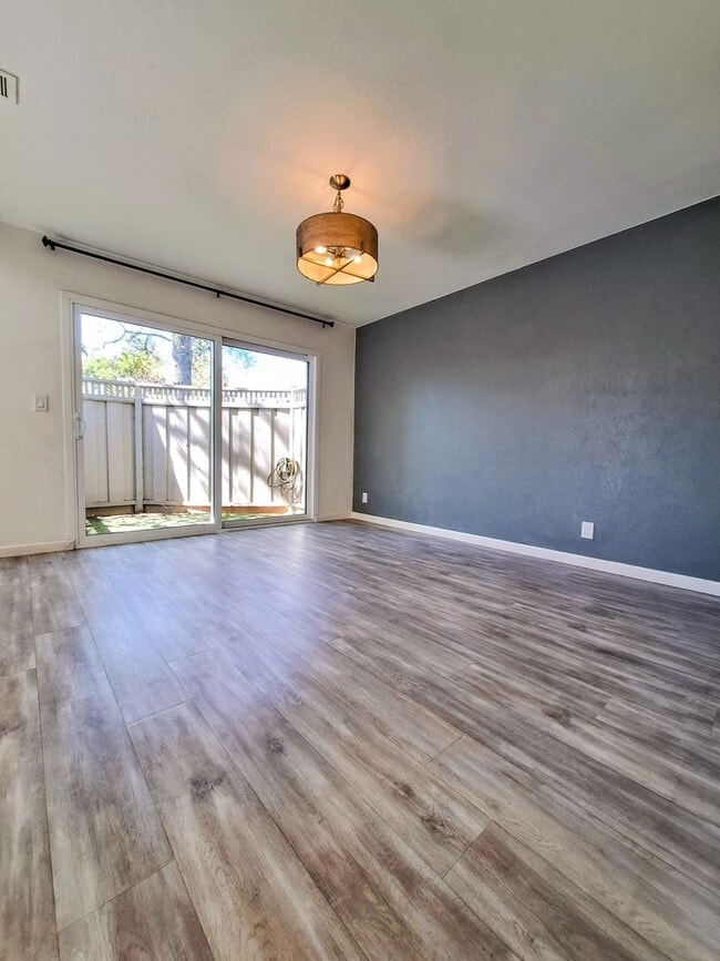 Building Photo - Spacious Two-Story 3bd Townhouse With Private Patios, Balcony, & Garage