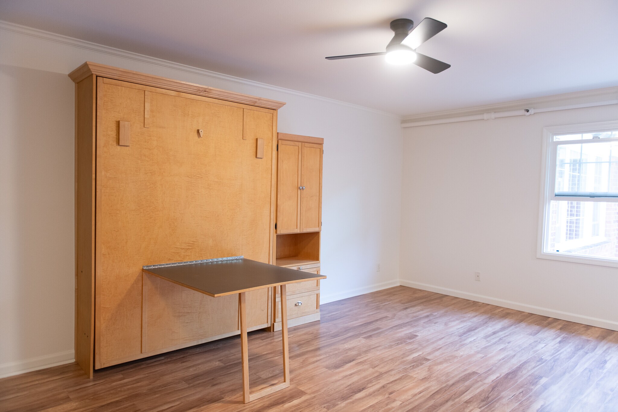Main room with table open - 701 NE 28th Ave