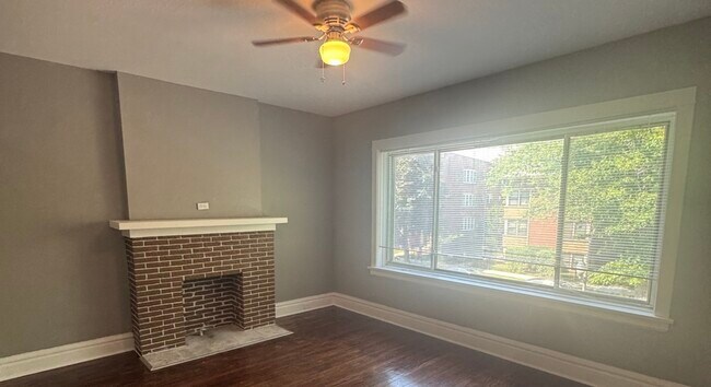 Building Photo - 7827 S Colfax Ave
