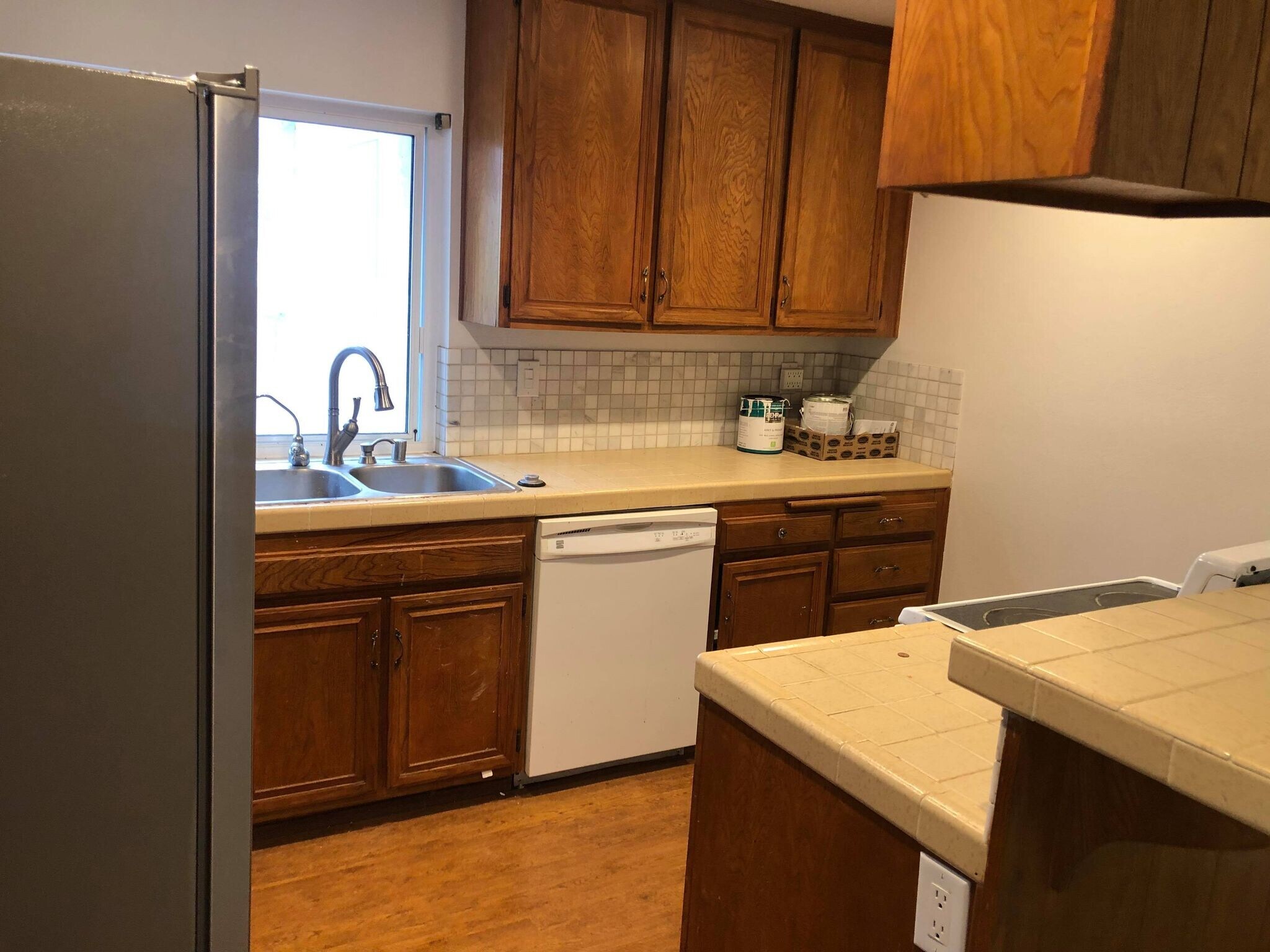 Kitchen; fridge to the left, stove to the right, dish washer and sink in front - 9594 Easter Way