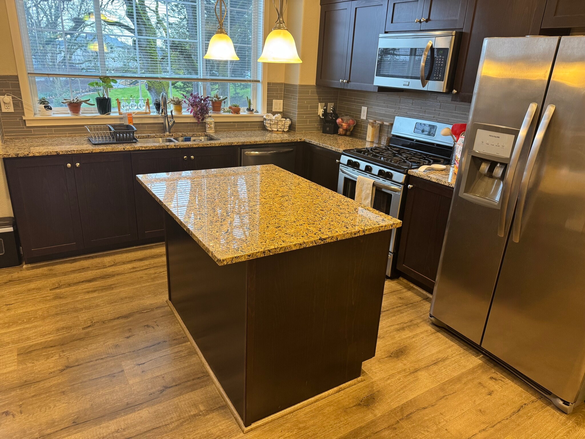 Kitchen. Microwave, dishwasher, oven/gas stove, and refrigerator included. - 13102 SW Aubergine Ter