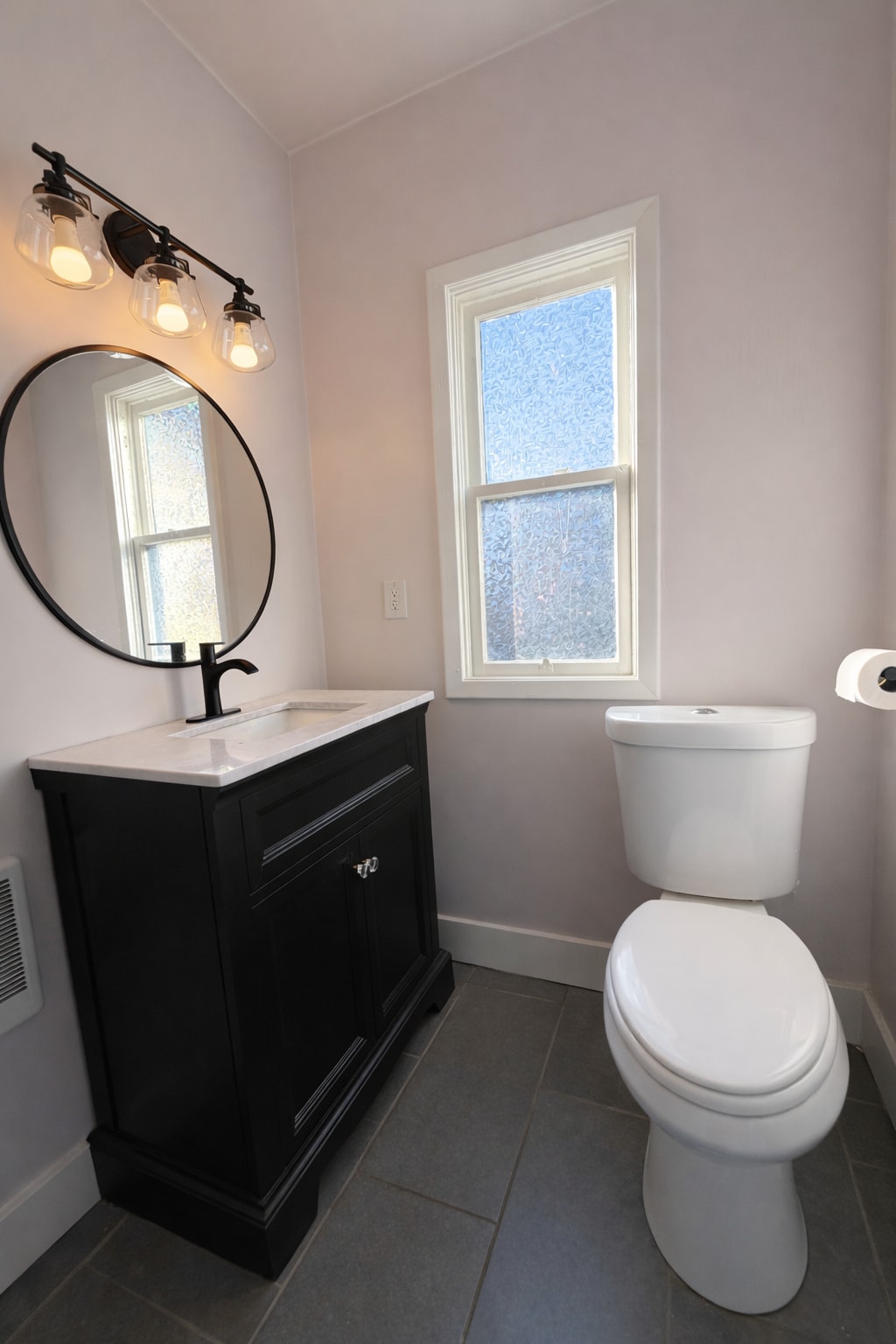 Fresh, modern bathroom with great light and clean, classic finishes. - 604 NE Shaver St