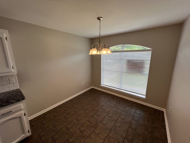 Building Photo - Charming 4-Bedroom Home with Large Backyar...