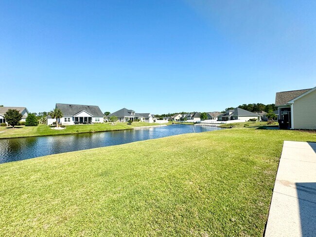Building Photo - Like New 3 Bedroom & 2 Bath pond front home in Hillsborough! Enjoy the Community Pool, Playground...