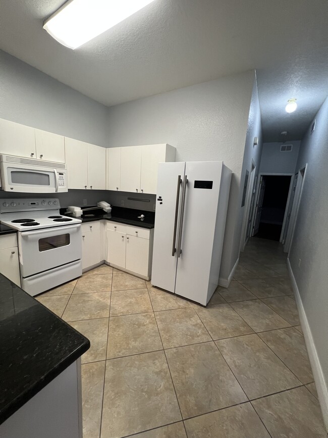 Kitchen and Hallway - 5811 La Costa Dr