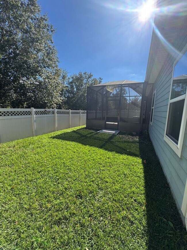 Building Photo - COMING SOON! Beautiful 4BR 3BA Home w/ Screened Lanai & Pond View • Garage Parking • Fenced Yard ...