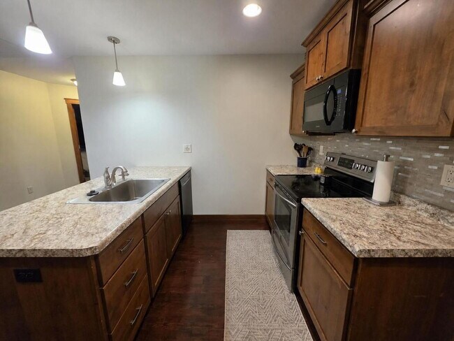 Building Photo - FREE SEPTEMBER RENT for this Spacious 4-Bedroom Home with Vaulted Ceilings with Finished Basement...