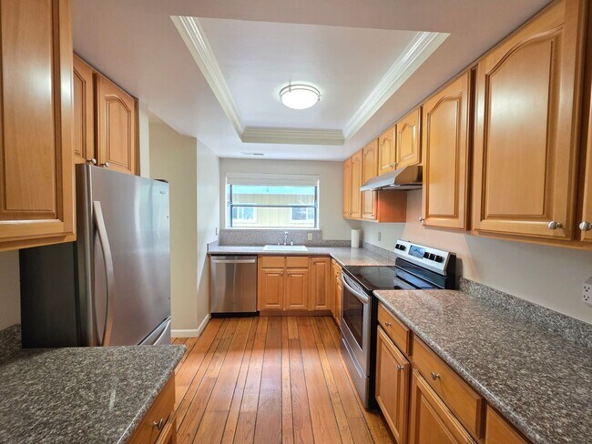 Building Photo - Spacious 2BR Condo with Central A/C, Bonus Room & Huge Storage – Walk to Burlingame Avenue