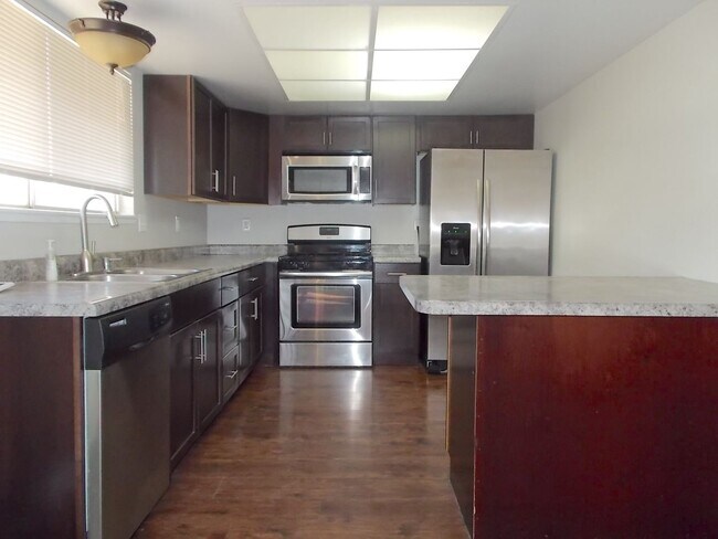 Building Photo - Spacious 4-Bedroom, 3-Bathroom Home with Open Floor Plan & Large Backyard – Prime Location!