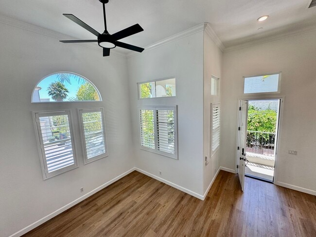 Building Photo - Beautifully Remodel Townhouse with AC & Two Car Garage!