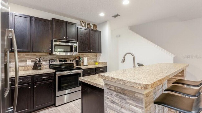 Building Photo - 3 Bedroom 3 Bath Kissimmee Emerald Lake Townhome with 2 Master Suites and Stainless Appliances!