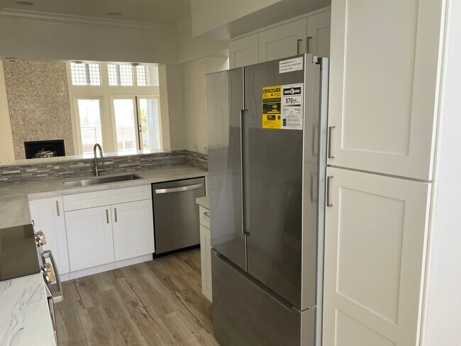 New Boise refrigerator & food closet, open to livingrm - 811 Spindrift Dr
