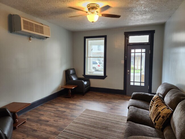 Living Room Angle One (Common Area) - 117 W Piedmont St