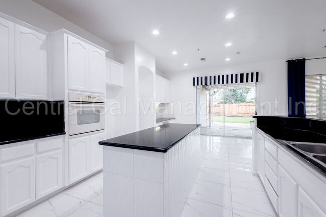 Building Photo - 4 Bedroom/3 Bath Home with Paid Solar - $3295 Per Month!