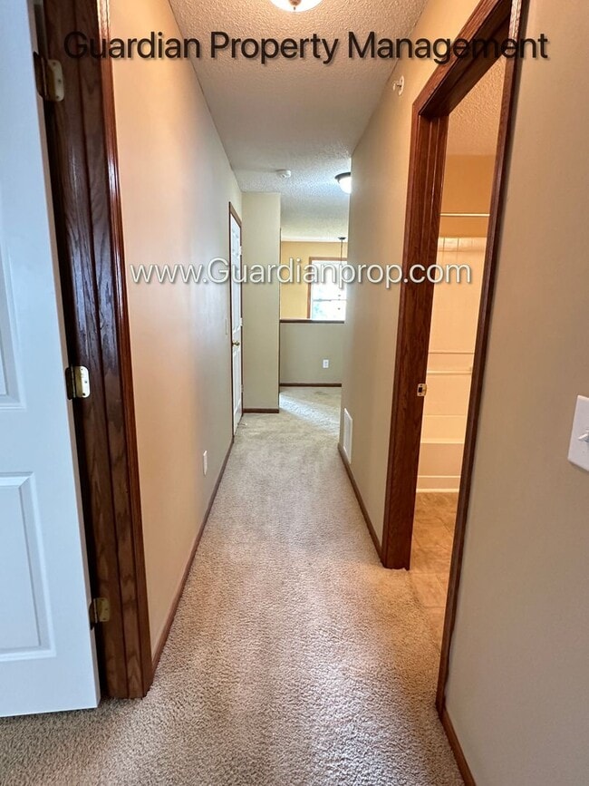 Building Photo - Pet Free Champlin Town Home, 3.5 Baths, 2 Car Garage, Dishwasher, Balcony, Available end of April