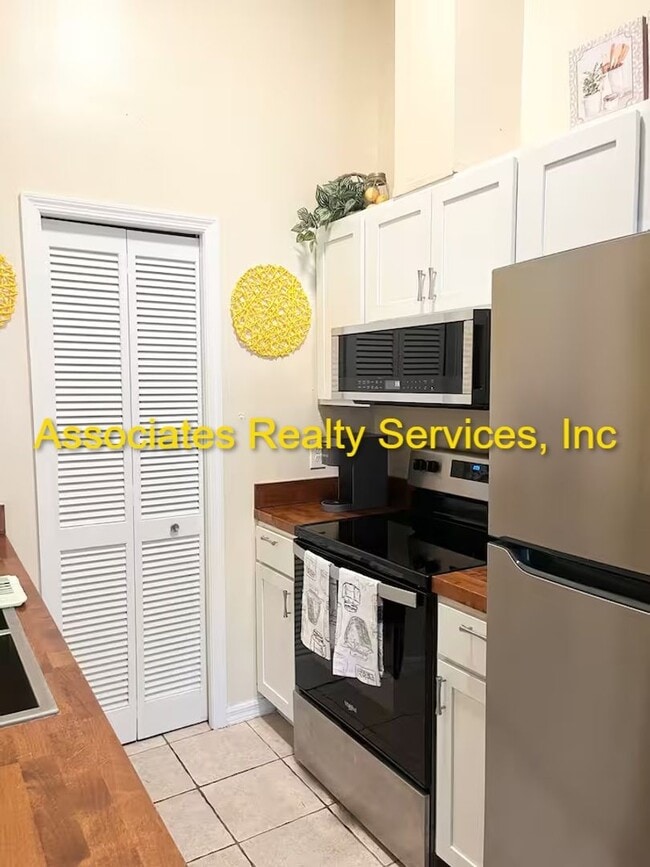 Building Photo - Beautifully furnished  2-Bedroom Duplex – ...