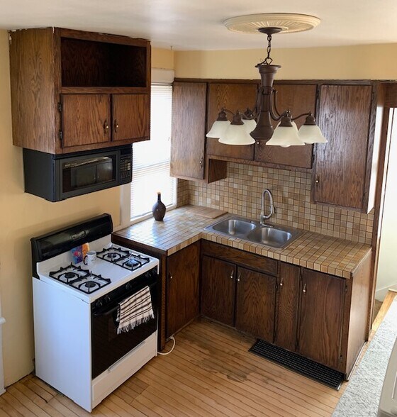View of kitchen from stairs to 2nd floor - 2454 N Pierce St