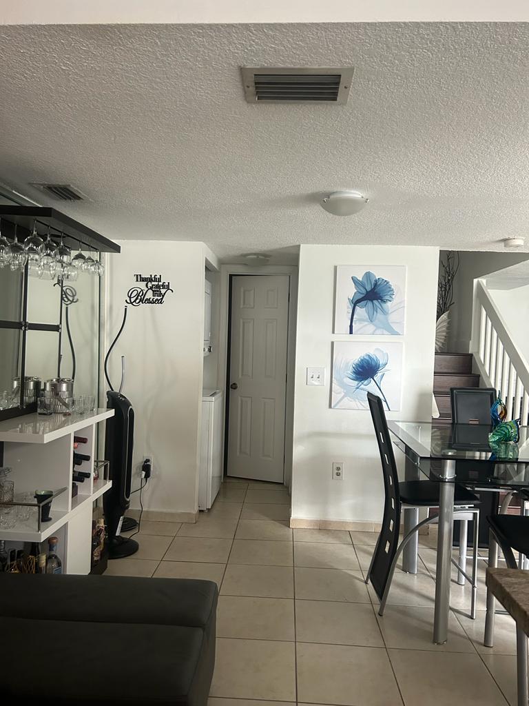 Downstairs din rm & half bath hallway - 6211 SW 138th Ct