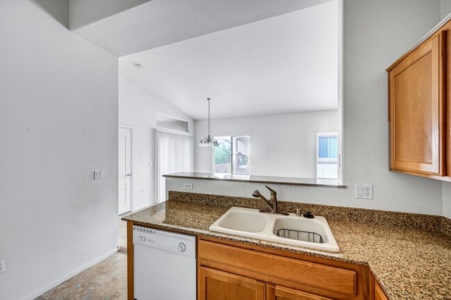 Building Photo - Second Story Condo with Open Floor Plan and Granite Counters