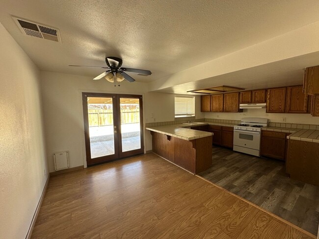 Building Photo - Your Dream Home: Spacious Interiors, Garage, and Huge Backyard