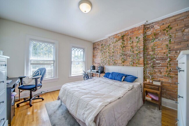 Building Photo - Charming 5-Bedroom Home with Exposed Brick and Modern Upgrades