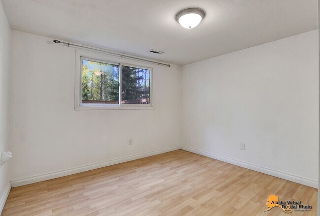 Building Photo - Eagle River Home w/ Fenced Yard, Sunroom, and Garage!