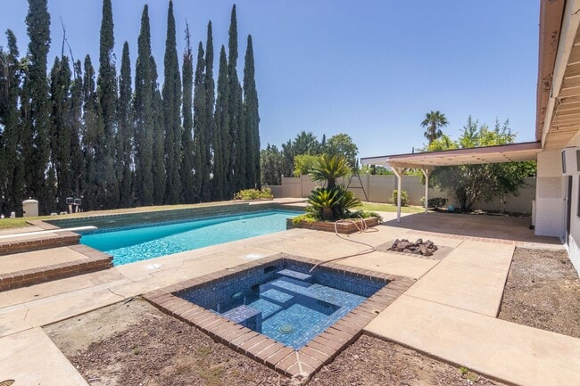Building Photo - Spacious 3-Bedroom Home with Pool, Jacuzzi...