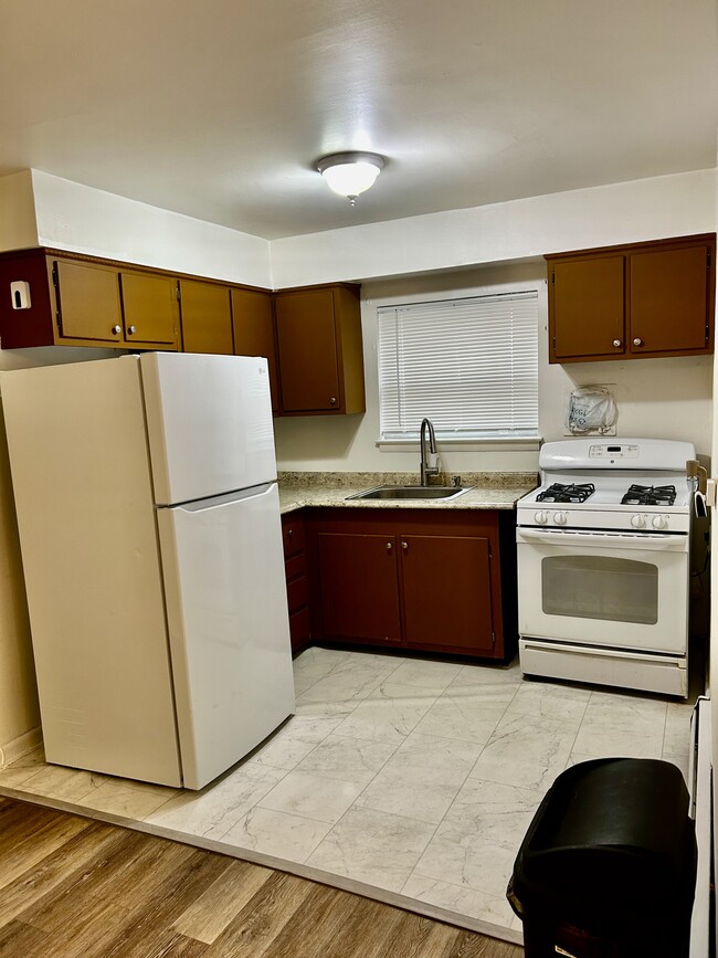 Kitchen, equip with ceiling fan. - 6008 N 12th St