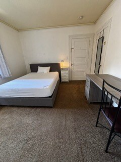 Single bedroom, full-size bed, looking to entry door - 2615 Parker St