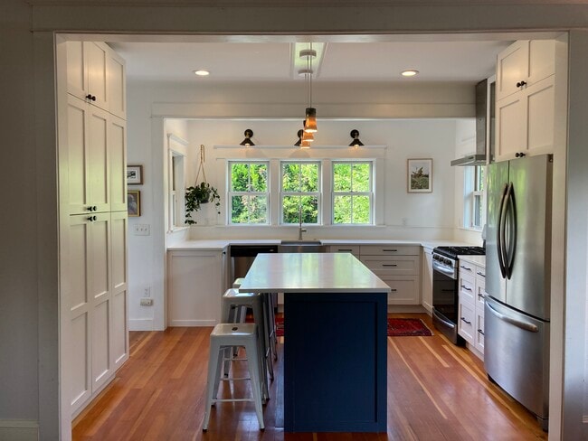Overlooking the spacious back yard, the kitchen is recently remodeled and a delight to cook in. - 1405 NE Buffalo St