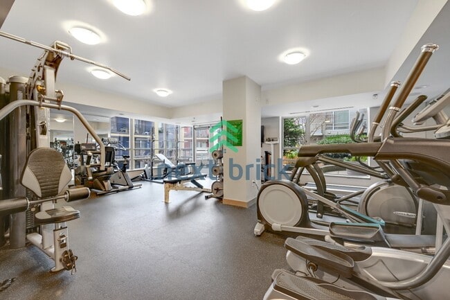 Building Photo - Stunning 2-Bed Corner Condo with Water and Mountain Views