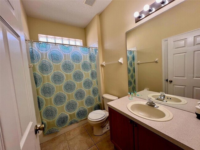 Building Photo - 8127 Fan Palm Way