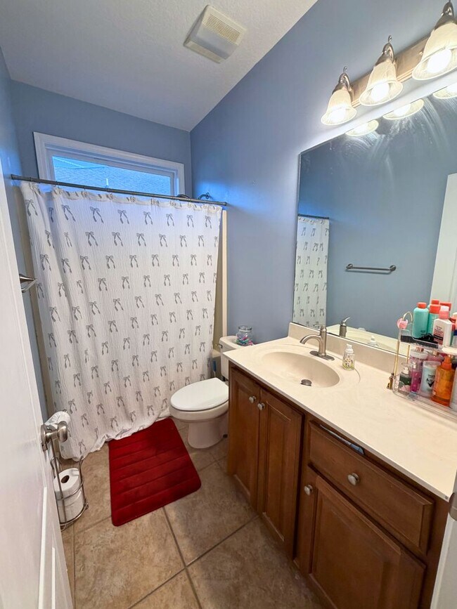 Building Photo - 3/2 with grass cutting included & access to community amenities.