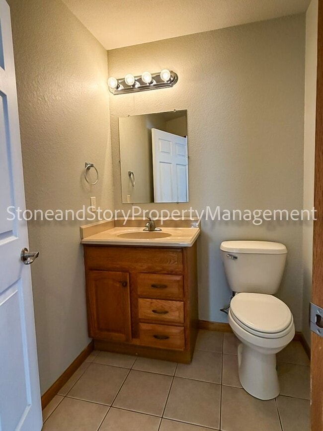 Building Photo - 2 bedroom 1.5 bath duplex with sunroom, 2 car garage and fenced yard