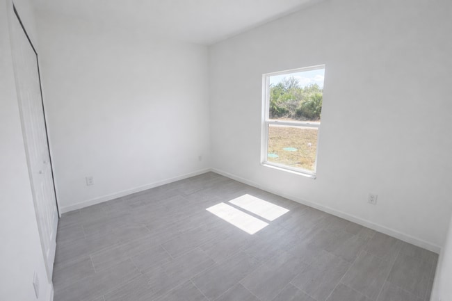 Building Photo - NEW CONSTRUCTION- Modern 3 Bed / 2 Bath Home in Lehigh Acres