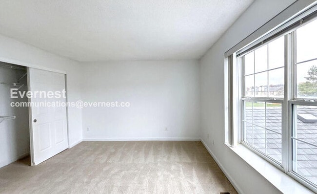 Building Photo - Spacious Condo with Modern Amenities and Garage Parking