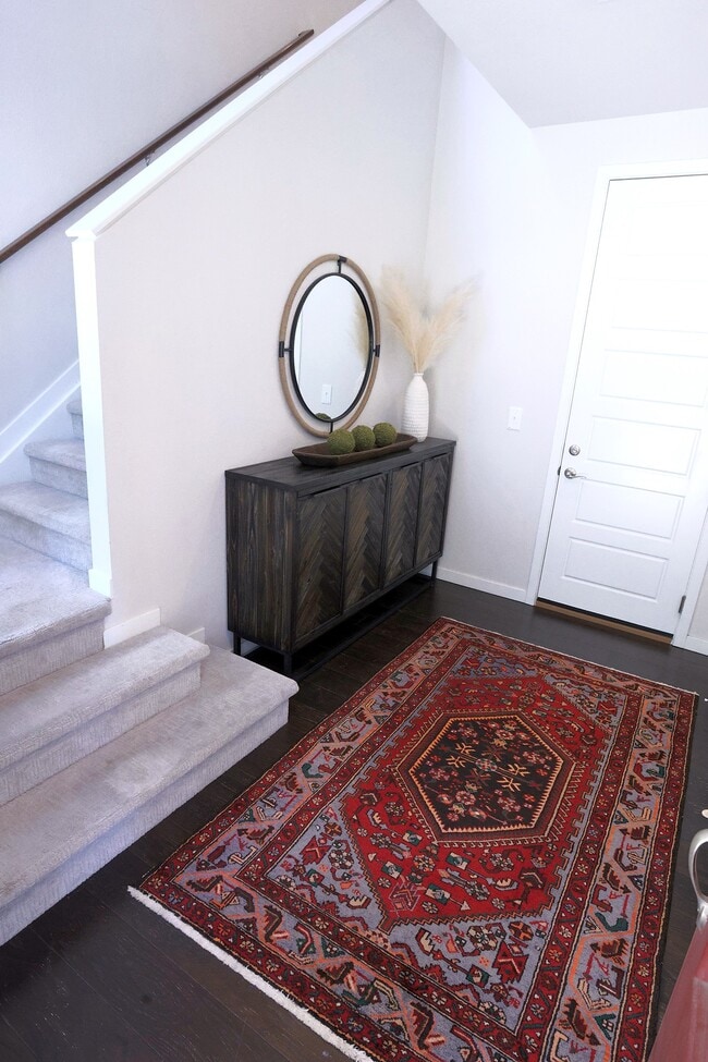 View from front door to garage door on lower level. Coat closet on this level. - 15637 E Broncos Pl