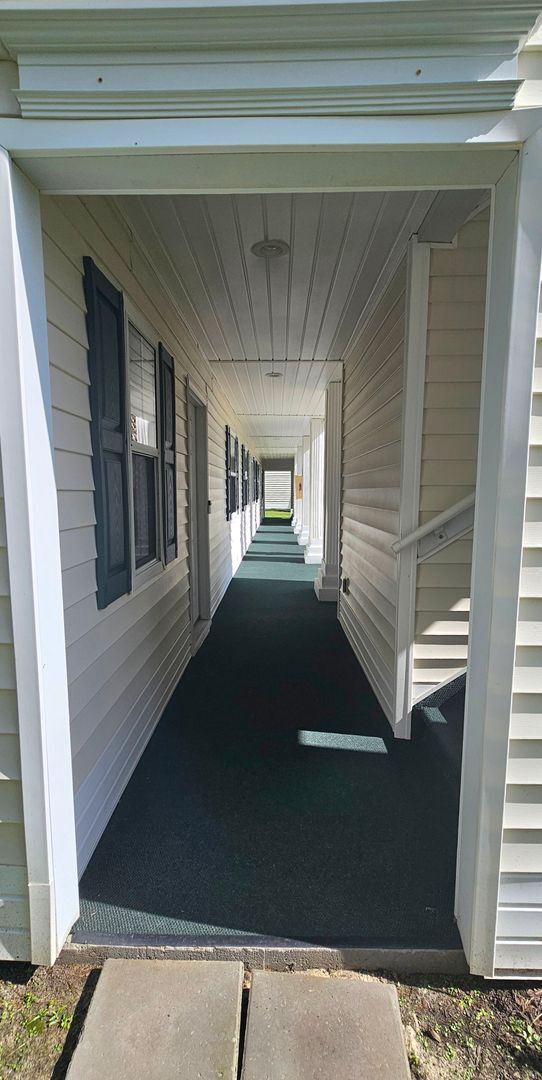 Building Photo - -First-Floor End-Unit | Fully Furnished 2B...