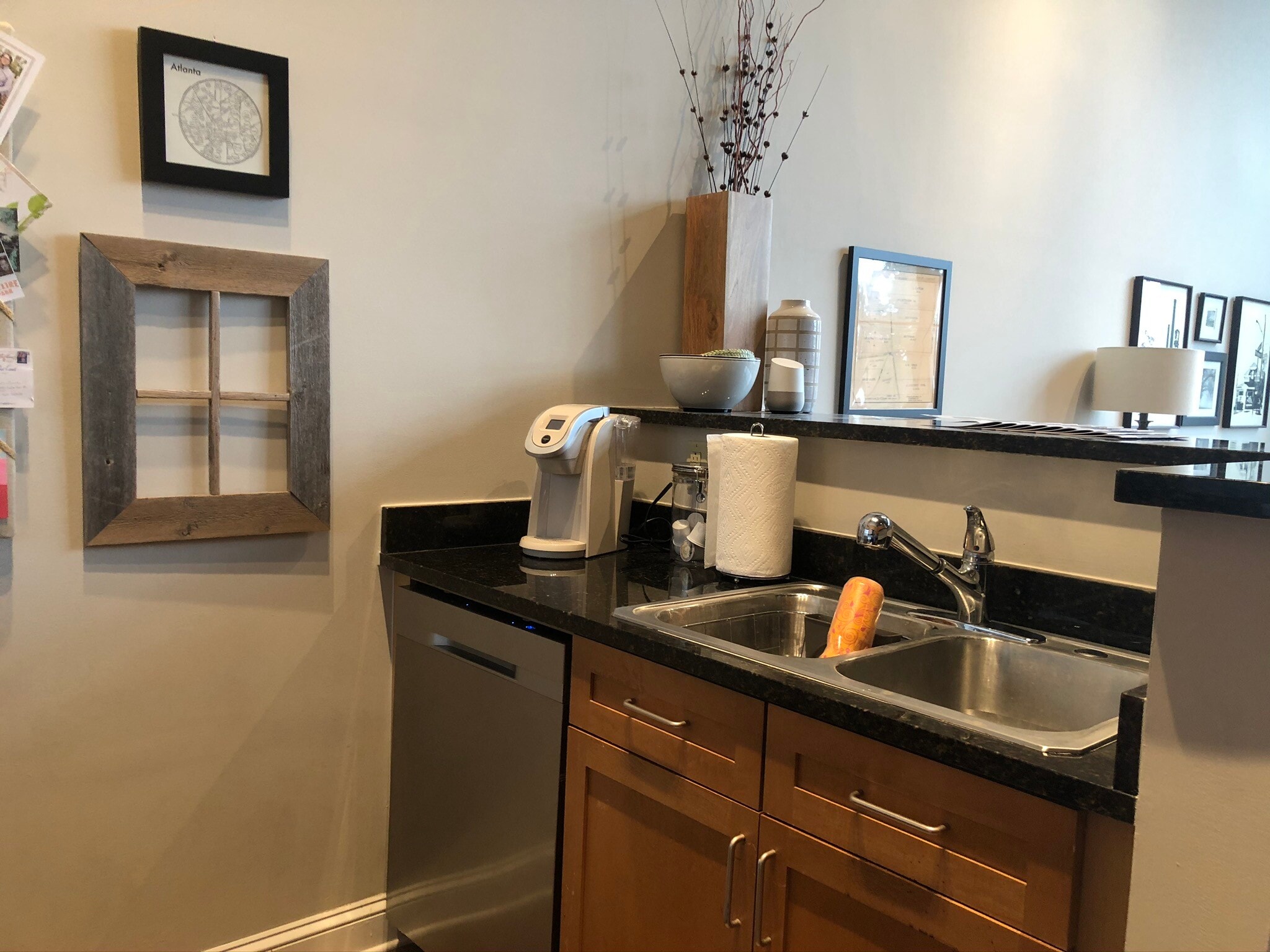 Kitchen looks over primary living area and windows - 572 Edgewood Ave NE